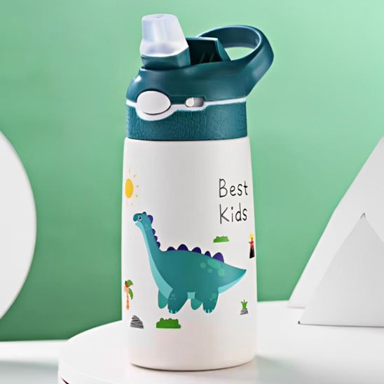 Gourde enfant verte avec dessin animé sur table