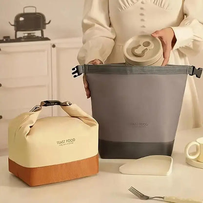 sac repa isotherme femme kaki ou gris sur table